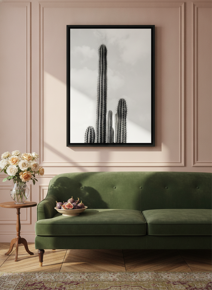 Canvas wall art with a black surround styled on the wall in a Parisian living room
