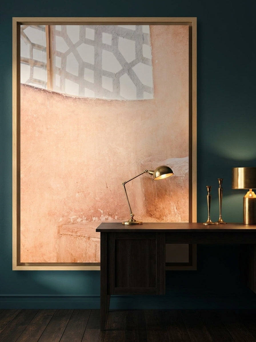 Oversized statement canvas wall art with a natural timber surround styled on the wall in a moody home office