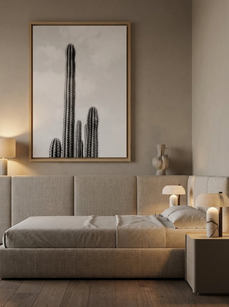 Oversized statement canvas wall art with a natural timber surround styled on the wall in a luxe bedroom