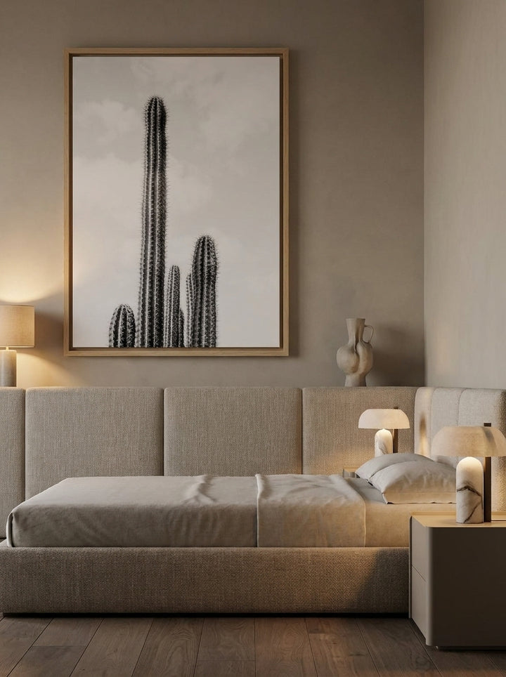 Oversized statement canvas wall art with a natural timber surround styled on the wall in a luxe bedroom