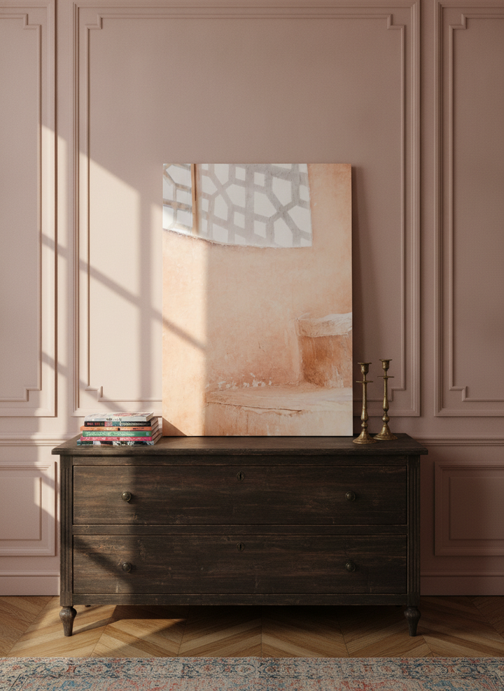 Stretched canvas wall art standing on a sideboard in a Parisian bathroom