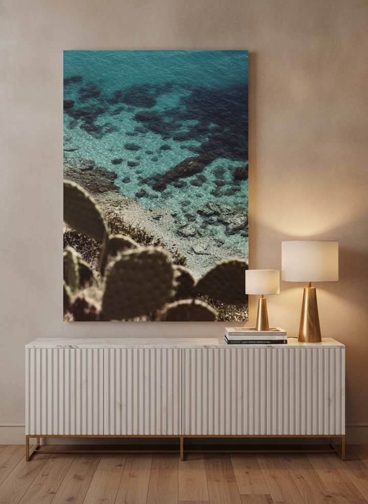 Stretched canvas wall art standing on a sideboard in a luxe living room