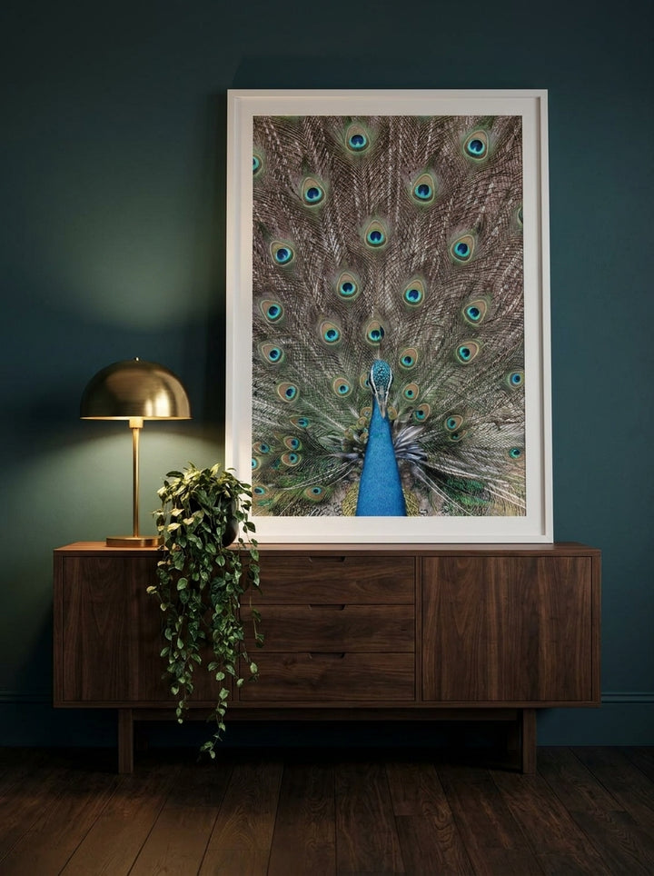 Modern wall art print standing on a sideboard in a moody bedroom