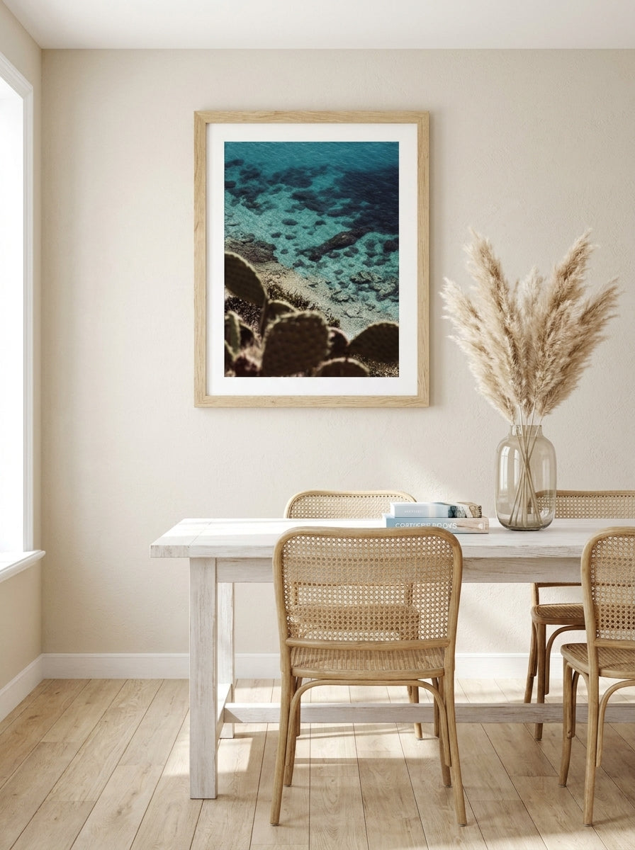 Modern wall art print styled on the wall in a coastal dining room