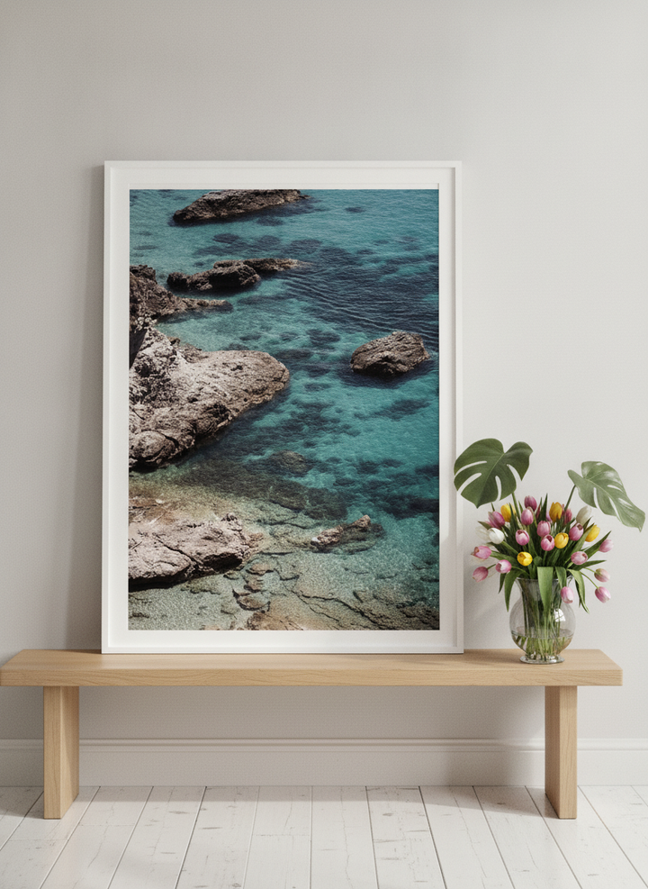 Modern wall art print standing on a bench in a bright Scandinavian bedroom