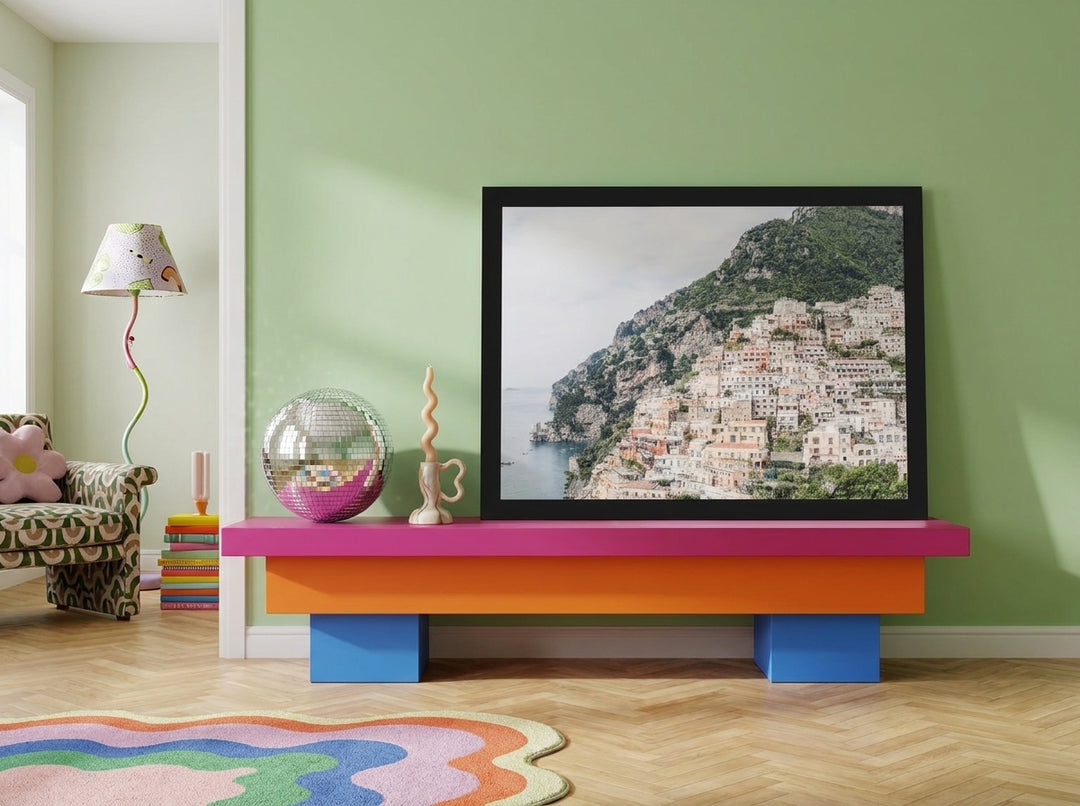Modern wall art print standing on a side table in a colourful eclectic living room