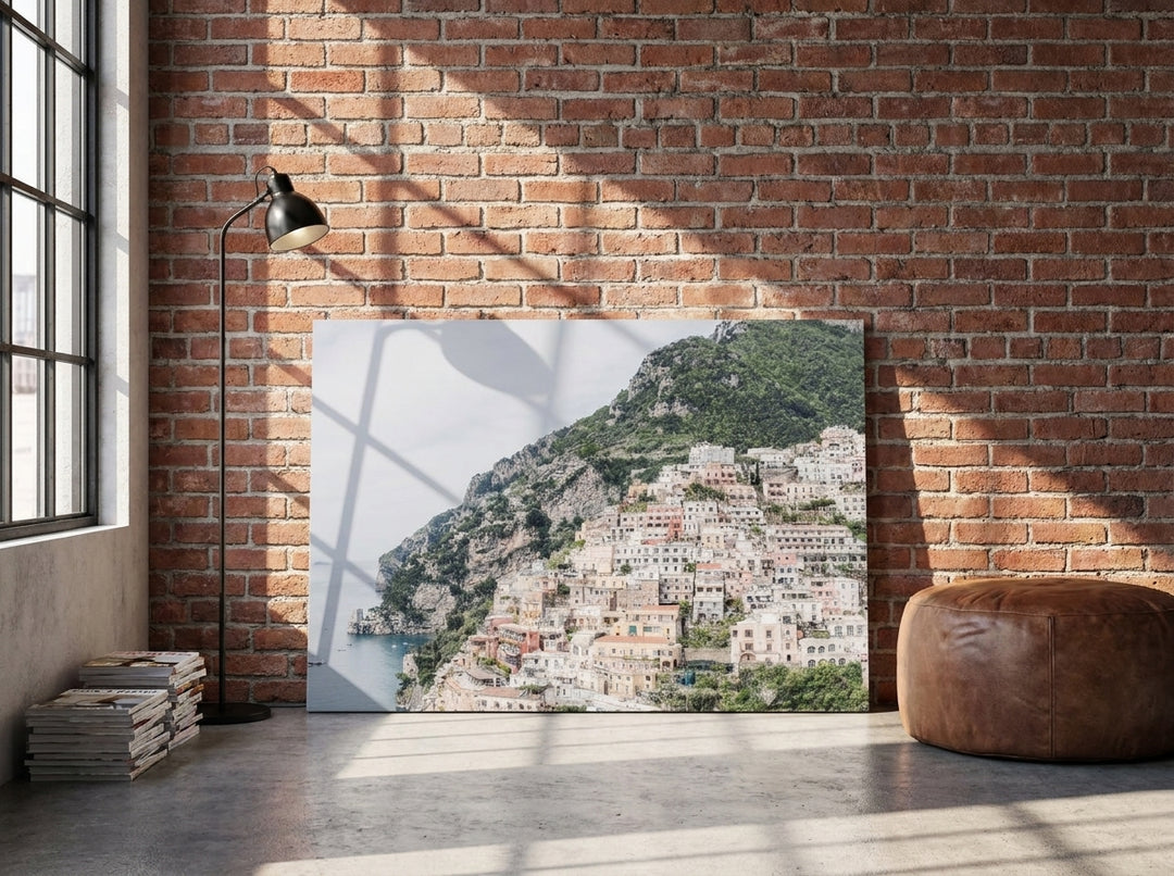 Stretched canvas wall art leaning against the wall in an industrial loft bedroom