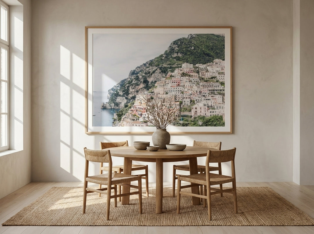 Oversized statement modern wall art print styled on the wall in a warm Japandi dining room