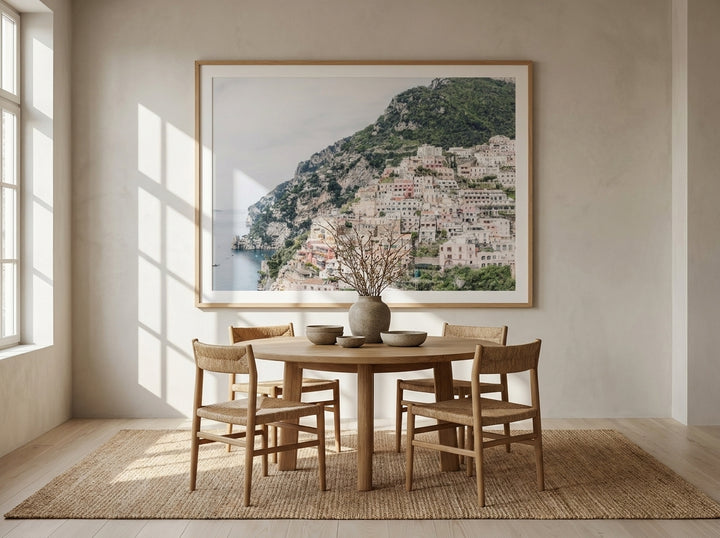 Oversized statement modern wall art print styled on the wall in a warm Japandi dining room