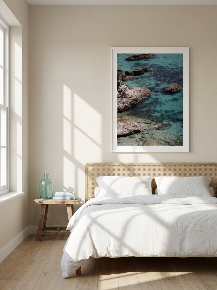 Oversized statement modern wall art print styled on the wall in a coastal bedroom