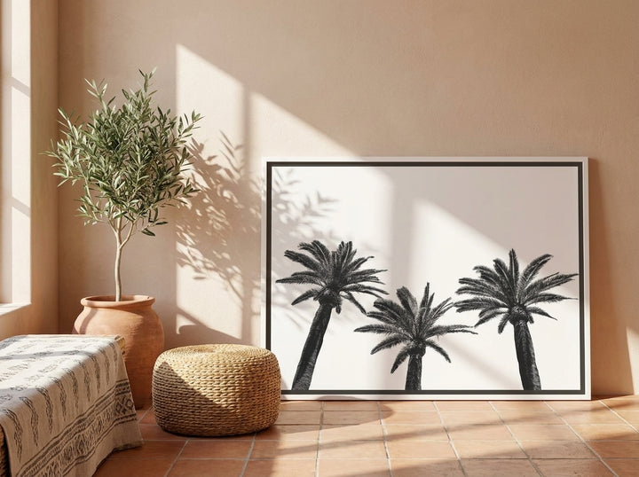 Canvas wall art with a white surround leaning against the wall in a Mediterranean bedroom