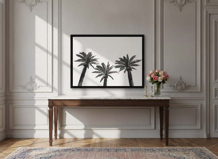 Canvas wall art with a black surround standing on a console in a Parisian living room