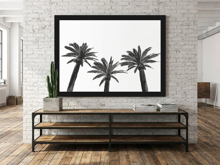Modern wall art print styled on the wall in an industrial loft living room