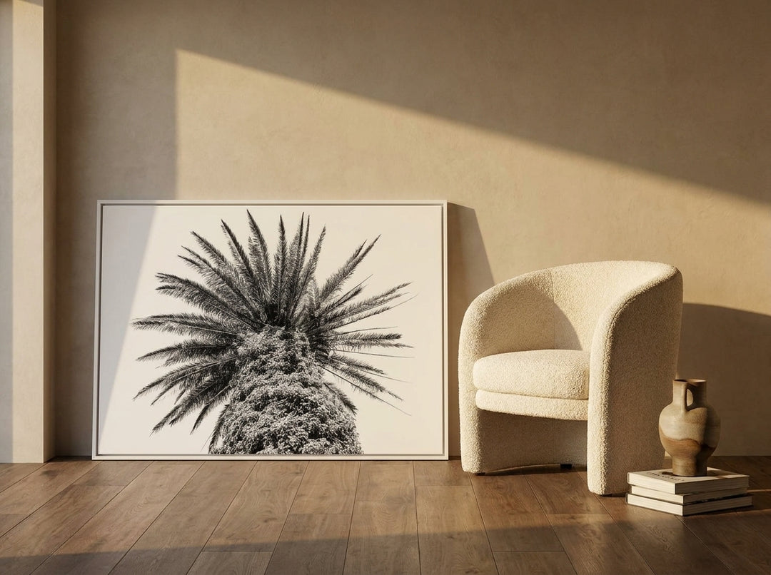 Canvas wall art with a white surround leaning against the wall in a luxe bathroom