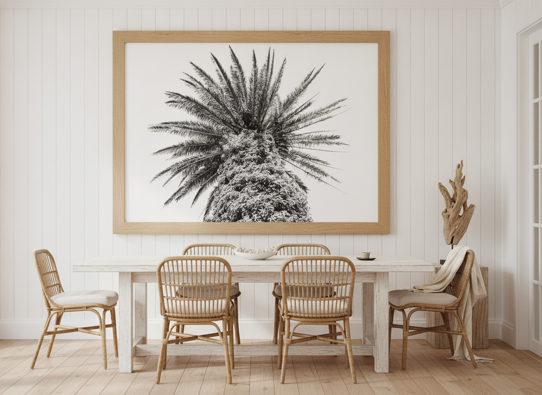 Oversized statement modern wall art print styled on the wall in a coastal dining room