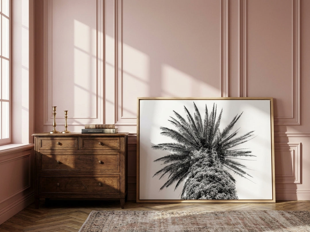Canvas wall art with a natural timber surround standing on a sideboard in a Parisian home office