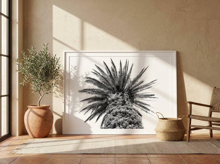 Oversized statement modern wall art print leaning against the wall in a Mediterranean living room
