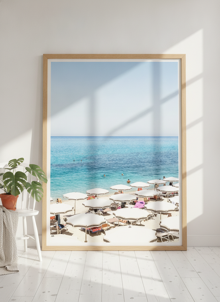 Oversized statement modern wall art print leaning against the wall in a bright Scandinavian dining room
