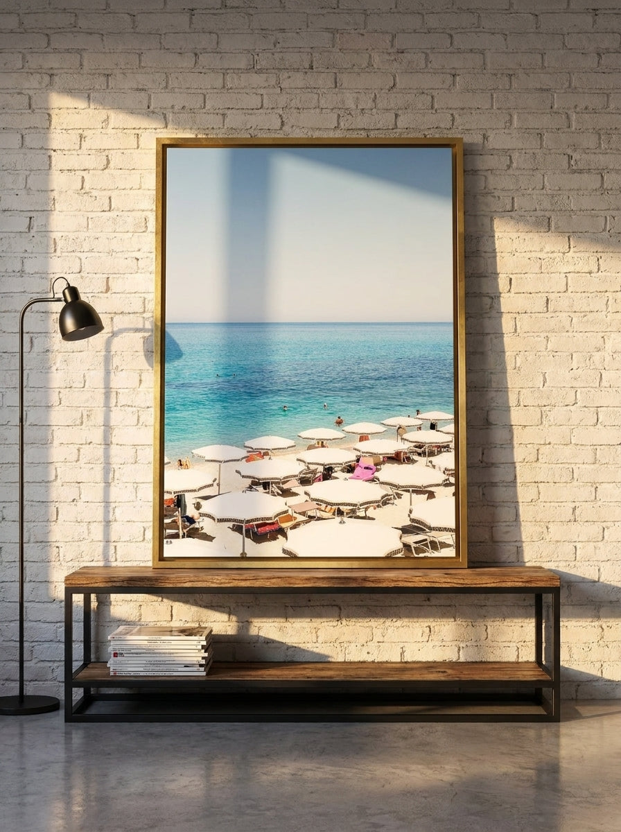 Canvas wall art with a gold leaf surround standing on a console in an industrial loft bedroom