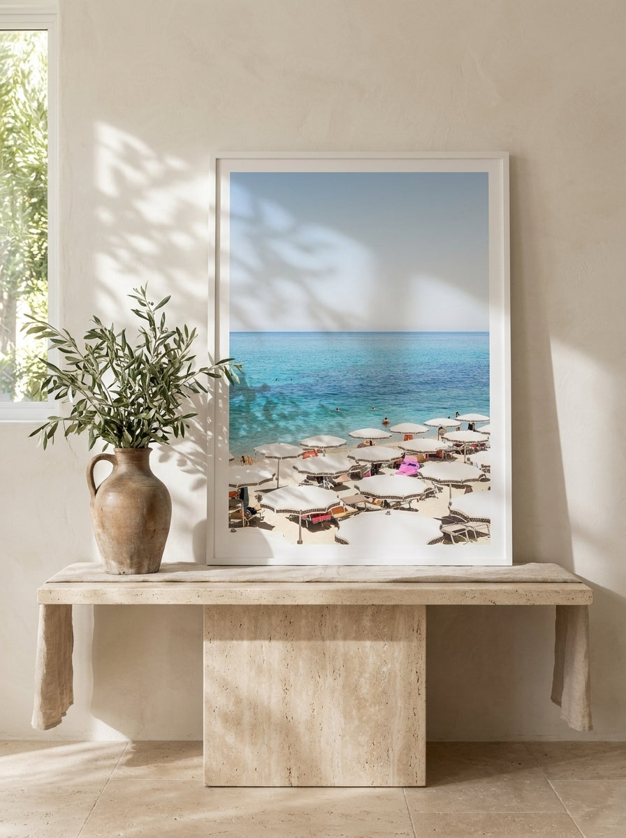 Modern wall art print standing on a console in a Mediterranean bedroom