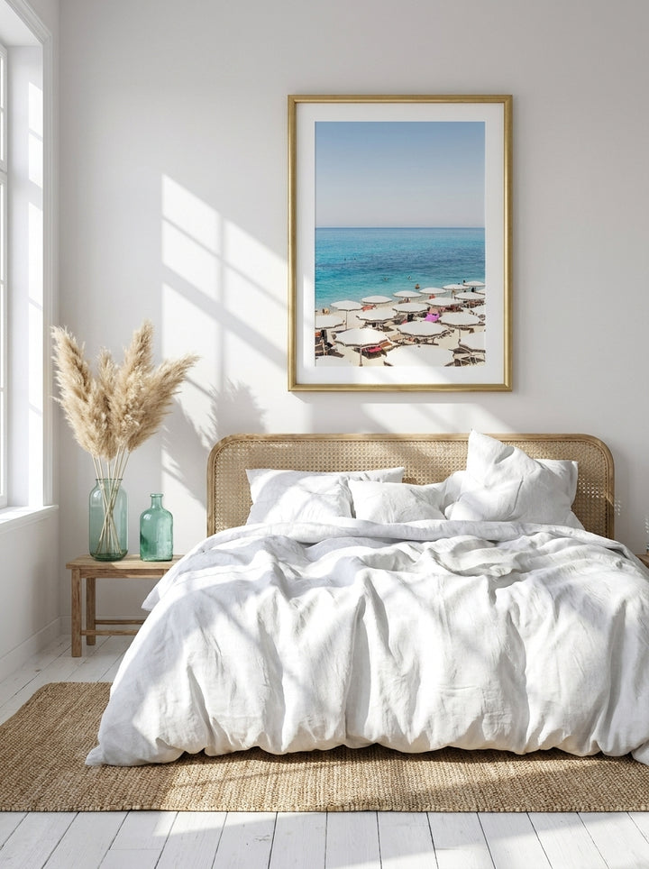 Modern wall art print styled on the wall in a coastal bedroom