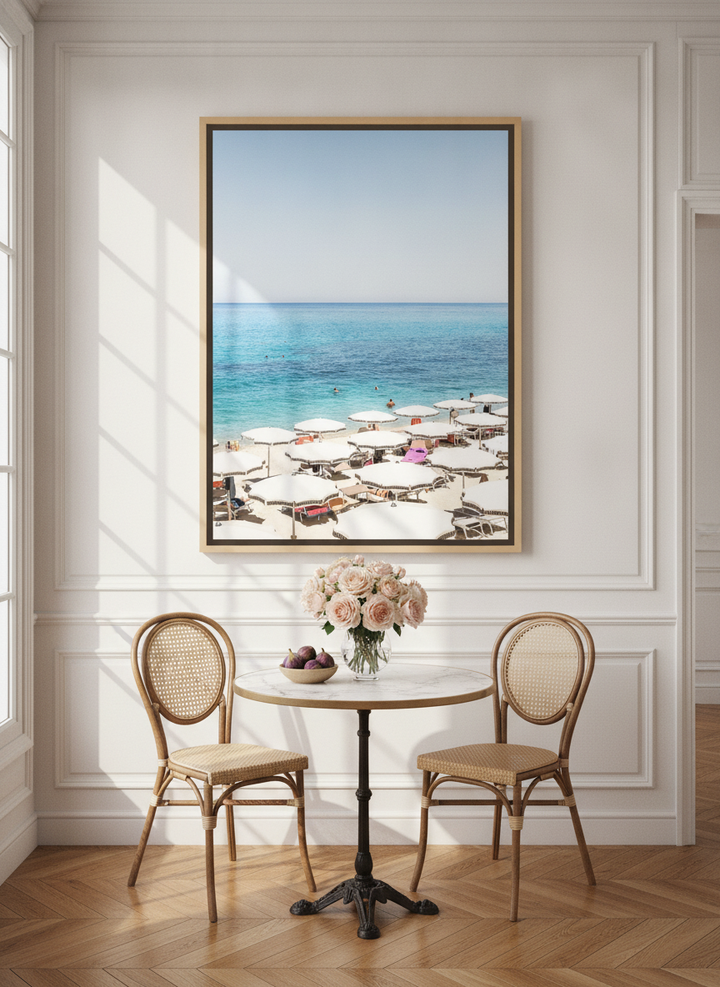 Oversized statement canvas wall art with a natural timber surround styled on the wall in a Parisian dining room