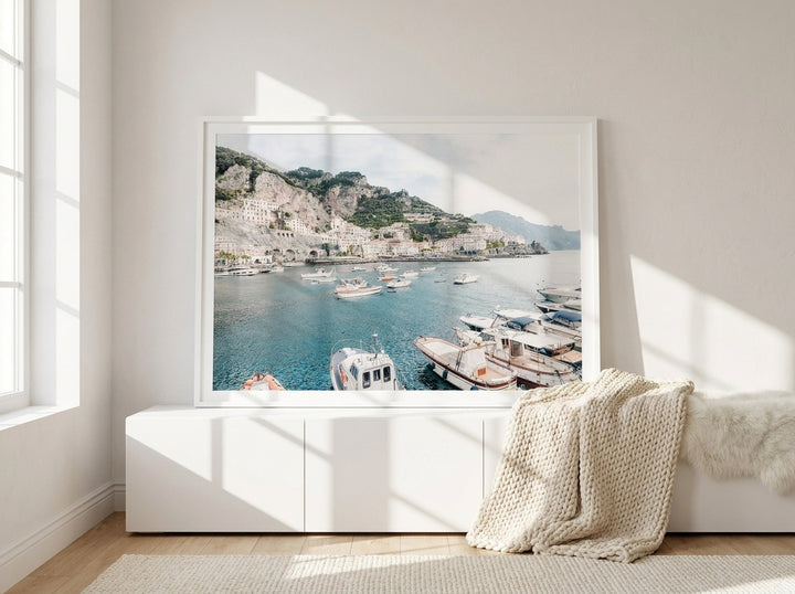Modern wall art print standing on a sideboard in a bright Scandinavian home office