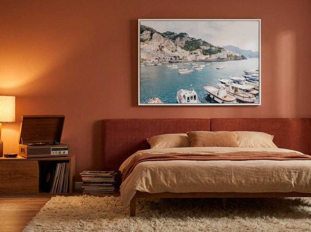 Canvas wall art with a white surround styled on the wall in a retro 70s bedroom