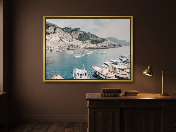 Canvas wall art with a gold leaf surround styled on the wall in a moody home office