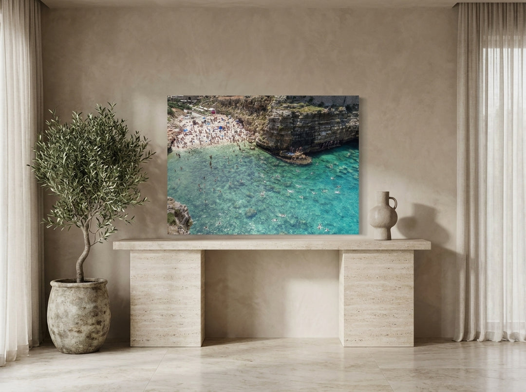 Stretched canvas wall art standing on a console in a luxe home office