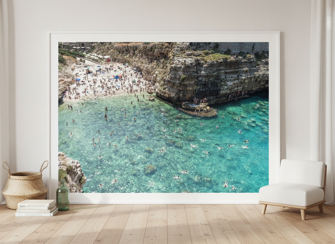 Oversized statement modern wall art print leaning against the wall in a coastal dining room