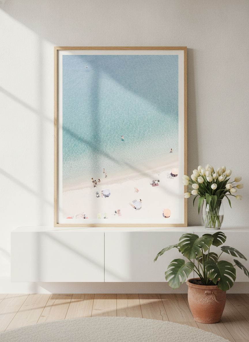 Modern wall art print standing on a sideboard in a bright Scandinavian bathroom