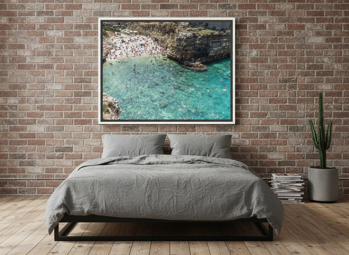 Canvas wall art with a white surround styled on the wall in an industrial loft bedroom