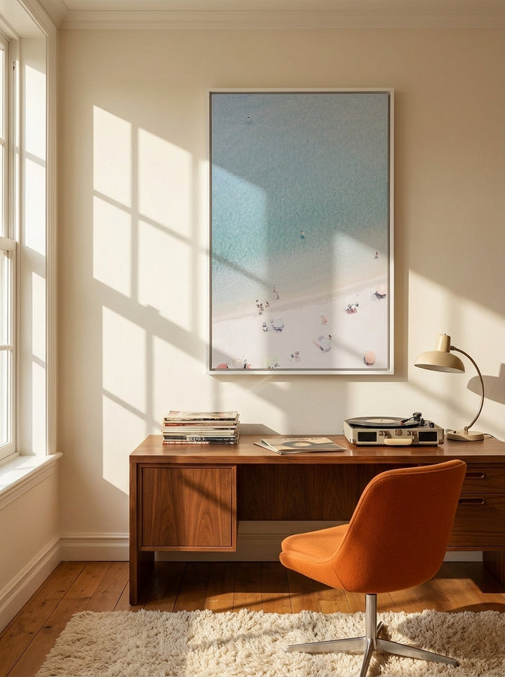 Canvas wall art with a white surround styled on the wall in a retro 70s home office