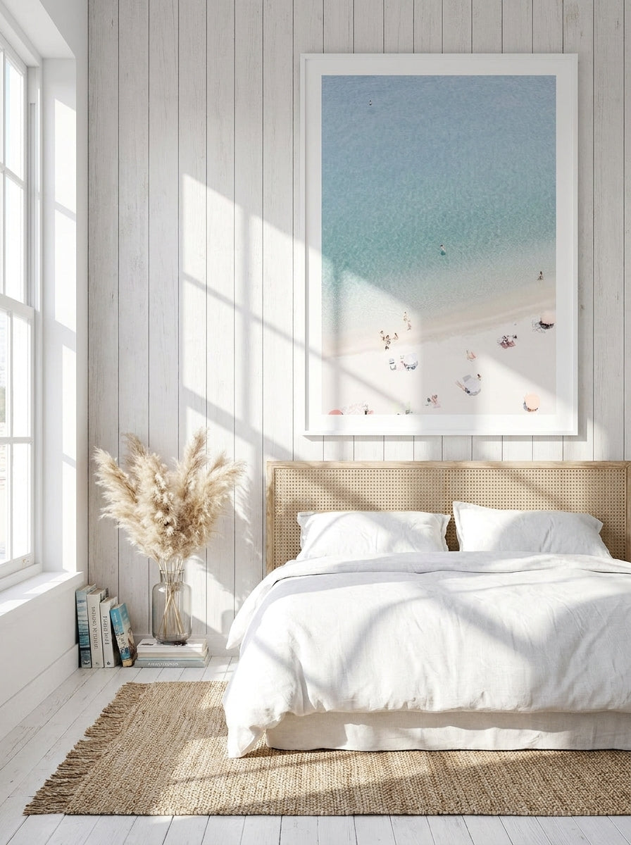 Oversized statement modern wall art print styled on the wall in a coastal bedroom