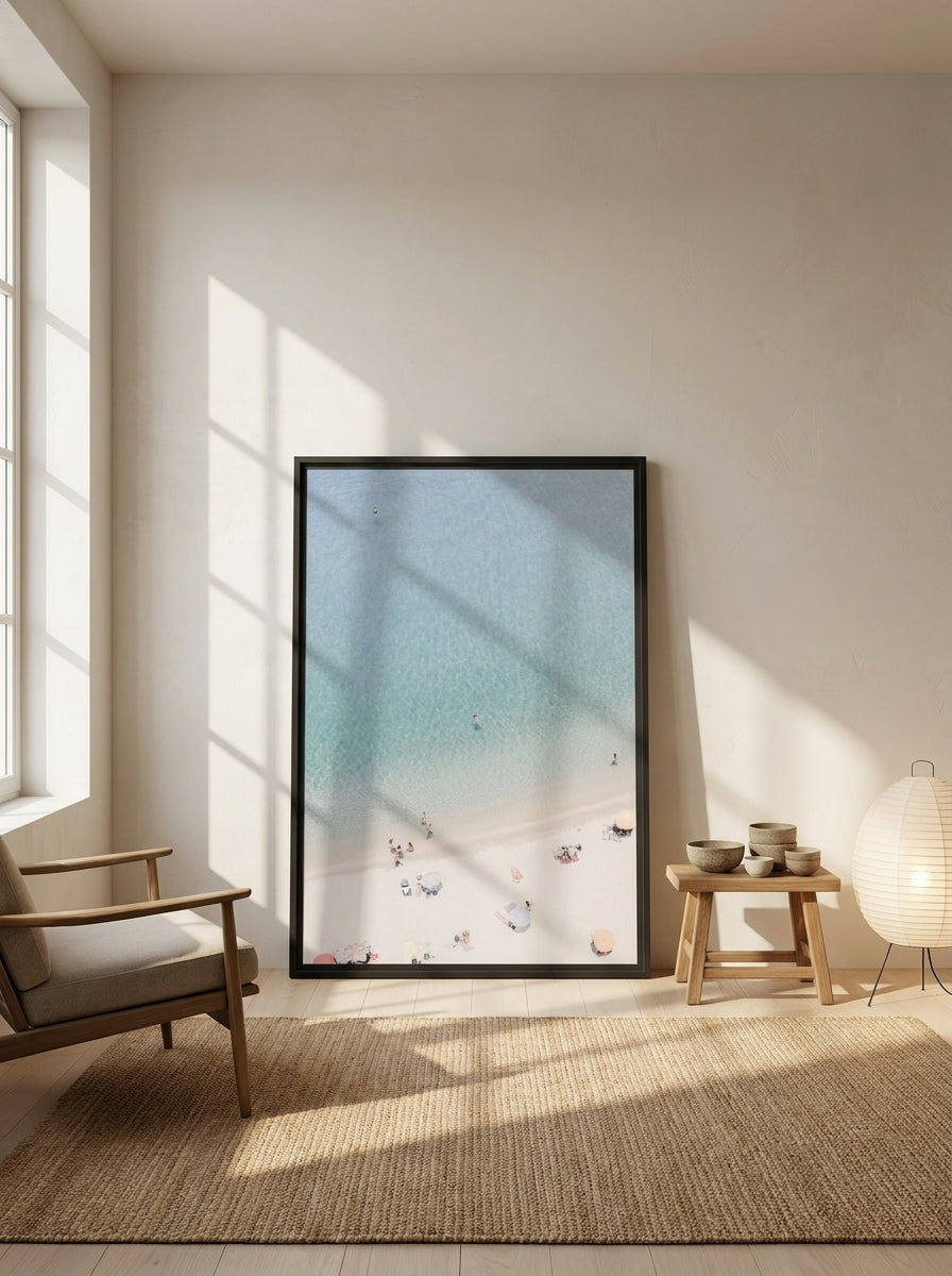 Oversized statement modern wall art print leaning against the wall in a warm Japandi living room
