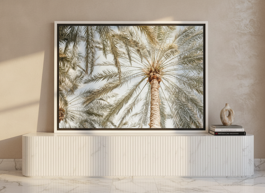 Canvas wall art with a white surround standing on a sideboard in a luxe home office