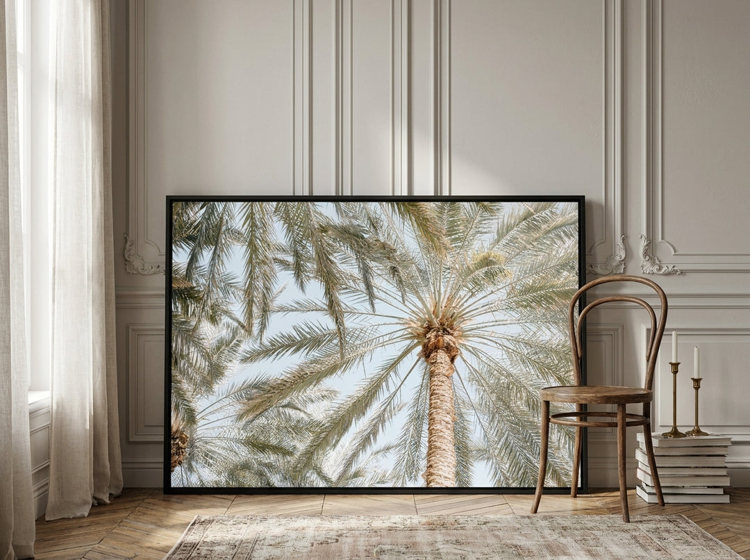 Canvas wall art with a black surround leaning against the wall in a Parisian bathroom