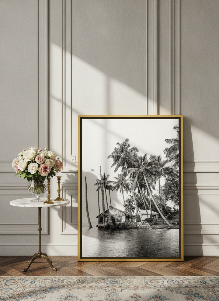 Canvas wall art with a gold leaf surround leaning against the wall in a Parisian bedroom