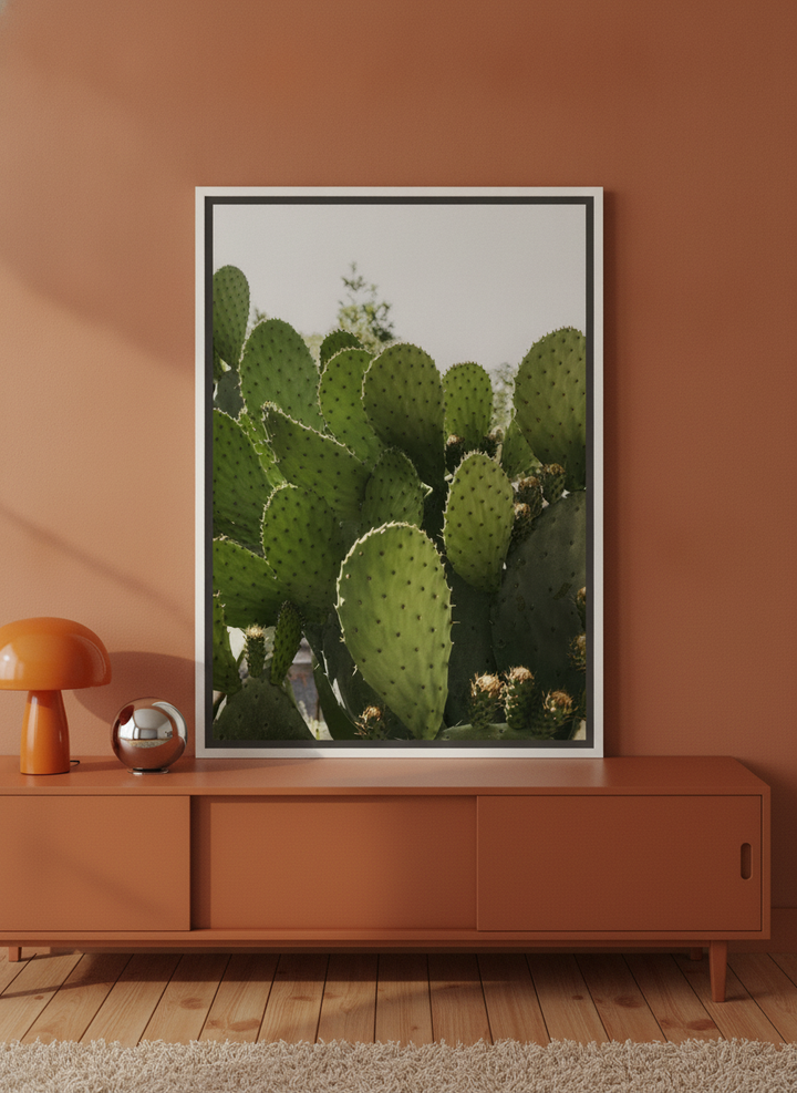 Canvas wall art with a white surround standing on a sideboard in a retro 70s bedroom