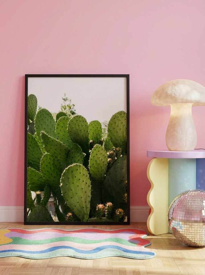 Modern wall art print leaning against the wall in a colourful eclectic bedroom