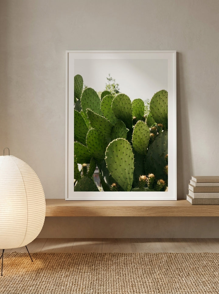 Modern wall art print standing on a shelf in a warm Japandi bathroom