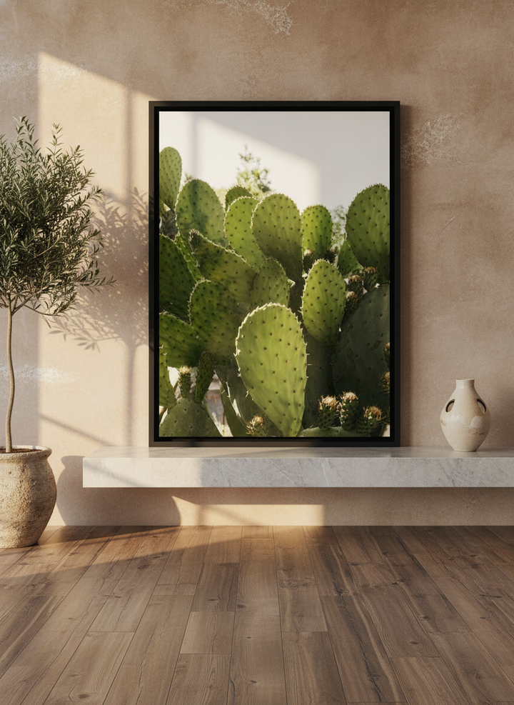 Canvas wall art with a black surround standing on a kitchen bench in a luxe kitchen