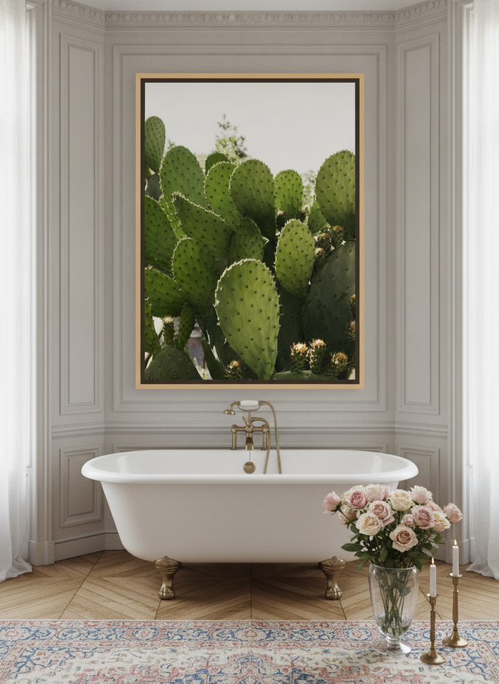 Oversized statement canvas wall art with a natural timber surround styled on the wall in a Parisian bathroom
