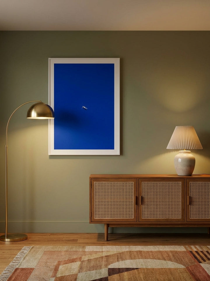Modern wall art print styled on the wall in a mid-century living room