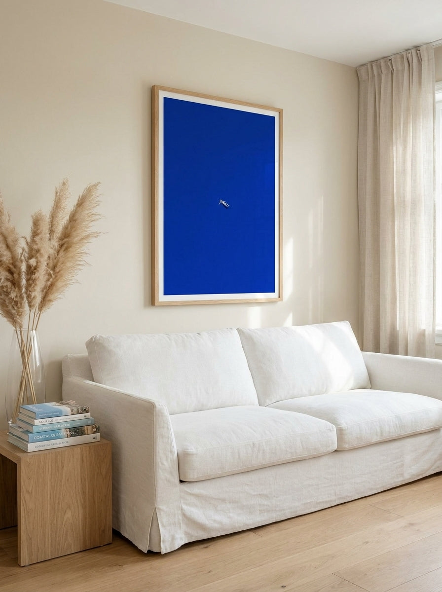 Modern wall art print styled on the wall in a coastal living room