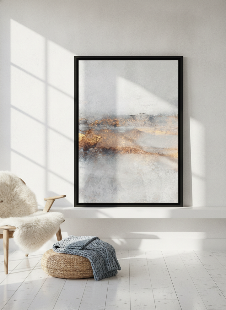 Canvas wall art with a black surround standing on a shelf in a bright Scandinavian living room