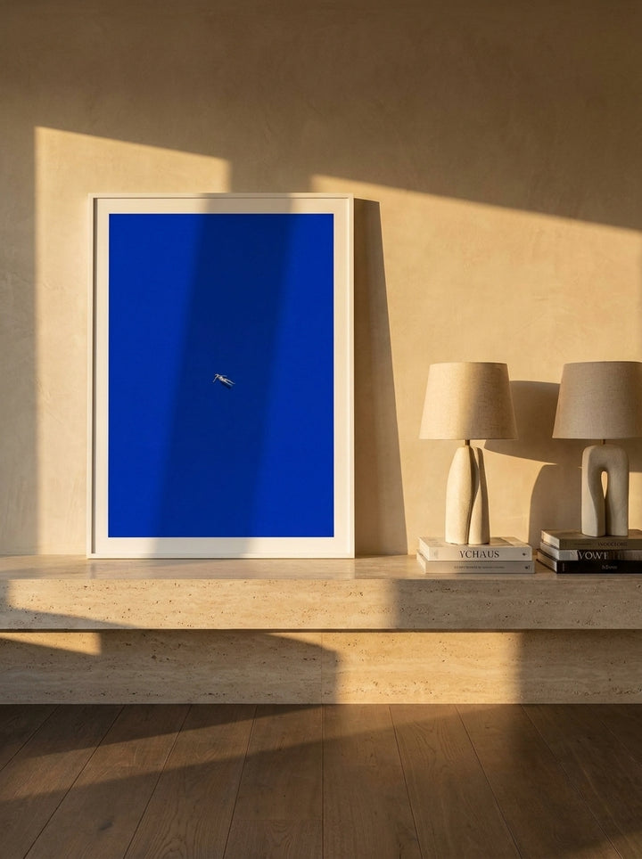 Modern wall art print standing on a console in a luxe bathroom