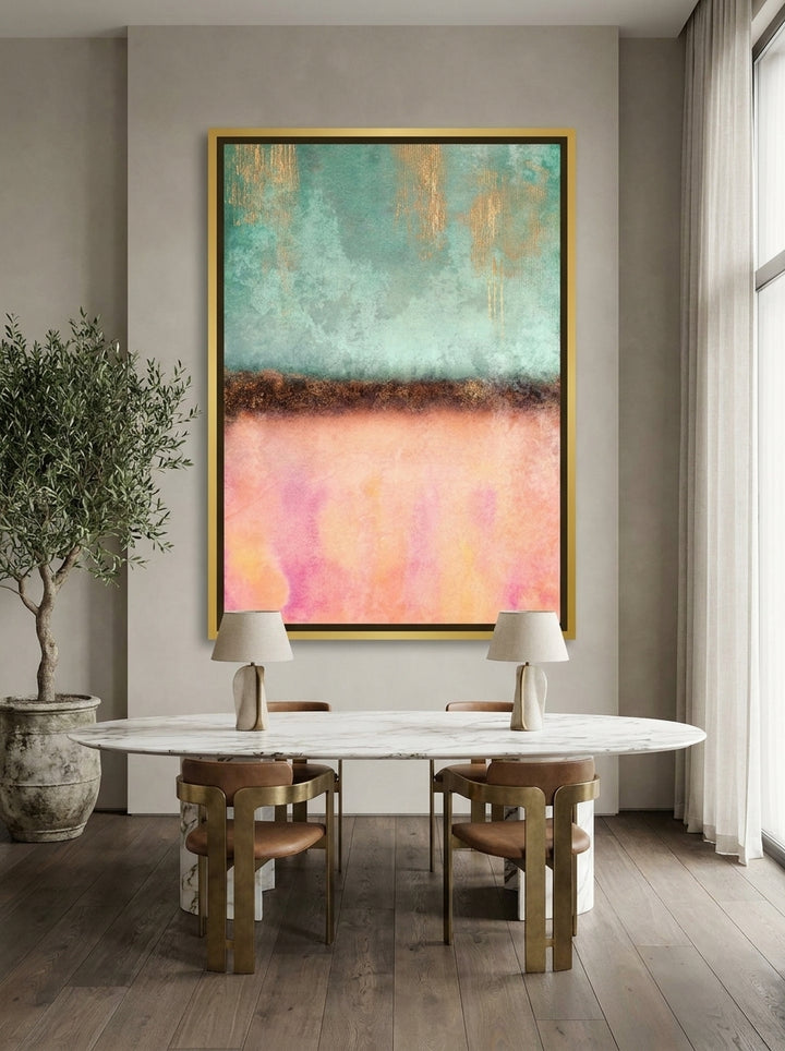 Oversized statement canvas wall art with a gold leaf surround styled on the wall in a luxe dining room