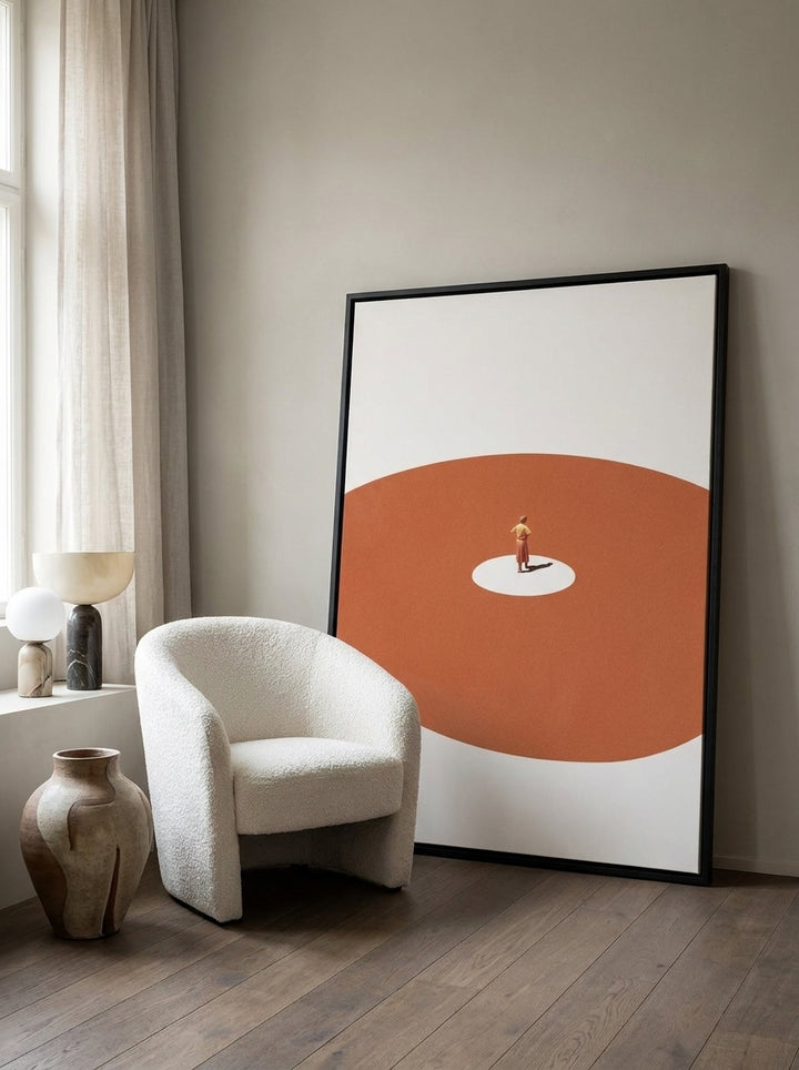Oversized statement canvas wall art with a black surround leaning against the wall in a luxe dining room